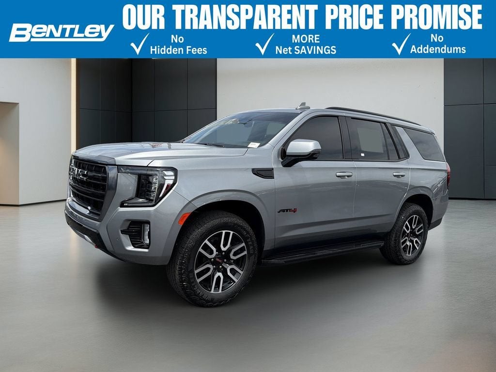 2024 GMC Yukon AT4 in Sterling Metallic — front three-quarter view