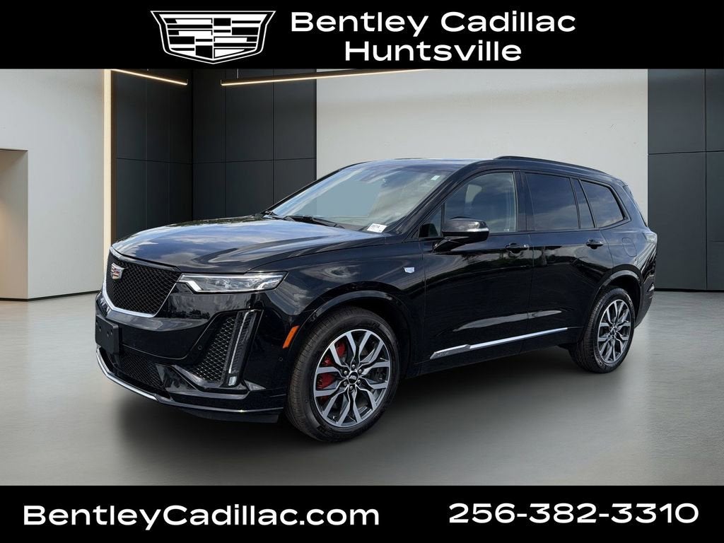 2025 Cadillac XT6 Sport in Stellar Black Metallic — front three-quarter view